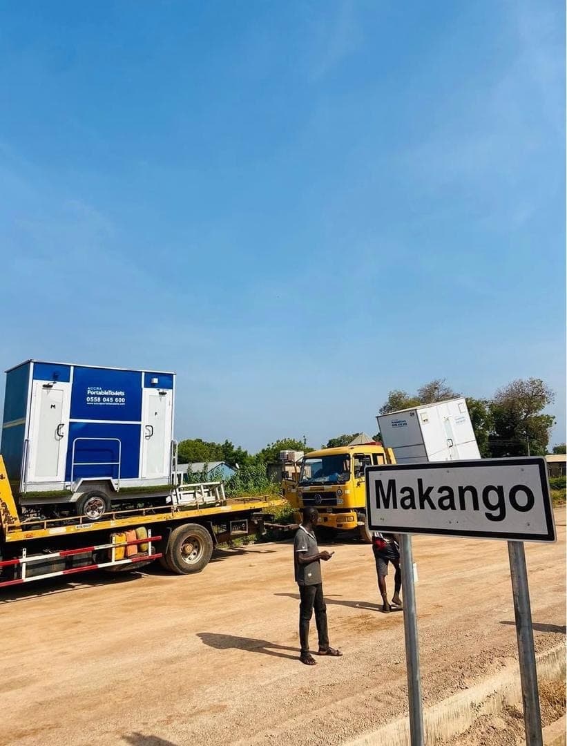 A unit being delivered by flatbed truck on an upcountry road